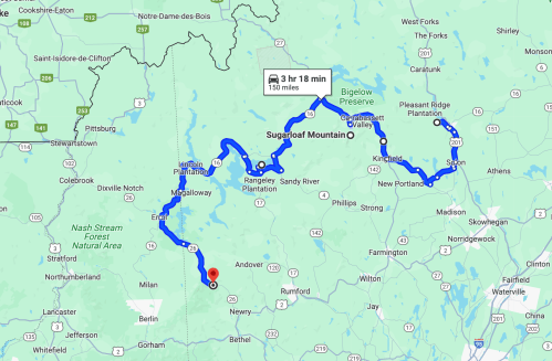 Map showing a route through Maine, highlighting Sugarloaf Mountain and nearby locations, with estimated travel time.